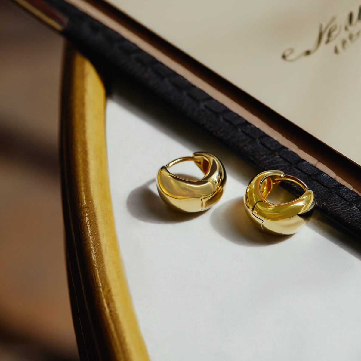 La Muse Yellow Gold Huggie Earrings