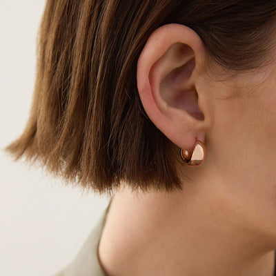 La Muse Rose Gold Huggie Earrings
